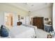 Spacious bedroom features a tray ceiling, plush carpet, and ample natural light at 3775 Via Mazzini Ct, Kissimmee, FL 34759