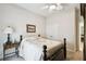 Bedroom featuring a queen bed, end table, and closet with bi-fold doors at 3775 Via Mazzini Ct, Kissimmee, FL 34759