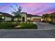 Beautiful single-story home featuring a manicured lawn and a brick-paved driveway with a two-car garage at 3775 Via Mazzini Ct, Kissimmee, FL 34759