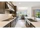 This modern kitchen offers white countertops, sleek cabinetry, and stainless steel appliances at 3775 Via Mazzini Ct, Kissimmee, FL 34759