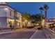 Charming street view with unique architecture, street lamps, and parked golf carts at 3775 Via Mazzini Ct, Kissimmee, FL 34759