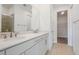 Bathroom with double sink vanity, white quartz countertops, and chrome fixtures at 4075 Bannock Ave, Tavares, FL 32778