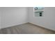 Bright bedroom featuring neutral carpet and a window at 4075 Bannock Ave, Tavares, FL 32778
