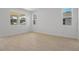 Bright bedroom with hardwood style flooring and views of the water and outside foliage at 4075 Bannock Ave, Tavares, FL 32778