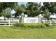 Lakeside Forest community sign surrounded by landscaping and a white fence at 4075 Bannock Ave, Tavares, FL 32778