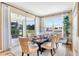 Dining room showcasing a large table, comfortable seating, and large sliding glass doors at 4075 Bannock Ave, Tavares, FL 32778
