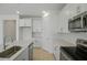 Spacious kitchen featuring an island with sink, countertops, and stainless steel appliances at 4075 Bannock Ave, Tavares, FL 32778