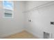 Clean laundry room with tile floor and a wire rack at 4075 Bannock Ave, Tavares, FL 32778