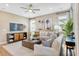 Cozy living room with neutral tones, comfortable seating, and plenty of natural light at 4075 Bannock Ave, Tavares, FL 32778