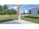 Spacious back porch offers views of the lush backyard and surrounding green spaces at 4076 Bannock Ave, Tavares, FL 32778