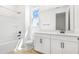 Modern bathroom featuring a tub and a vanity with white cabinets at 4076 Bannock Ave, Tavares, FL 32778