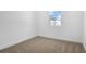 Neutral bedroom with carpeting and a window at 4076 Bannock Ave, Tavares, FL 32778