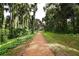 Scenic walking path surrounded by lush greenery, providing a tranquil escape into nature and inviting exploration at 4083 Bannock Ave, Tavares, FL 32778