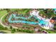 Lazy river view, surrounded by lush landscaping and lounge areas, offers a relaxing and tropical escape at 4751 Terrasonesta Dr, Davenport, FL 33837