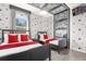 Charming themed bedroom featuring twin beds, Mickey Mouse decor, and bright pops of red color at 4751 Terrasonesta Dr, Davenport, FL 33837