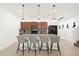 Kitchen island featuring pendant lighting, granite countertops, stainless steel appliances, and seating for four at 4751 Terrasonesta Dr, Davenport, FL 33837