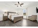 Bright main bedroom with a ceiling fan, large window, and neutral decor at 4751 Terrasonesta Dr, Davenport, FL 33837