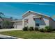 Charming single-story home with a well-manicured lawn and a two-car garage in a residential neighborhood at 5140 Four Strand Ct, St Cloud, FL 34772
