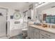 Full bathroom featuring dual sinks, a soaking tub, a glass enclosed shower, and vanity storage at 6017 Hickory Grove Ln, Port Orange, FL 32128