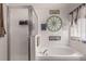 Relaxing bathroom featuring a soaking tub, separate shower, and tasteful decorative accents at 6017 Hickory Grove Ln, Port Orange, FL 32128