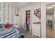 Comfortable bedroom features a well-organized closet, a dresser, and stylish decor at 6017 Hickory Grove Ln, Port Orange, FL 32128