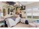 Eclectic bedroom decorated with wall art, comfortable bedding, and filled with personality at 6017 Hickory Grove Ln, Port Orange, FL 32128