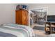 Cozy bedroom with a bed and open door to dining room; warm and inviting interior design at 6017 Hickory Grove Ln, Port Orange, FL 32128