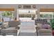 Bright living room featuring two armchairs and views of the backyard at 6017 Hickory Grove Ln, Port Orange, FL 32128