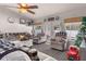Cozy living room featuring comfortable seating, natural light, and backyard access at 6017 Hickory Grove Ln, Port Orange, FL 32128