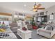 Comfortable living room featuring an entertainment center and access to backyard at 6017 Hickory Grove Ln, Port Orange, FL 32128