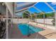 Inviting screened-in pool area perfect for outdoor relaxation and entertainment at 6017 Hickory Grove Ln, Port Orange, FL 32128