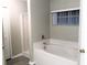 Clean bathroom with a soaking tub and a separate shower area at 610 Yak Ct, Kissimmee, FL 34759