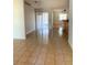 Spacious living room with tile flooring and sliding glass doors to the backyard at 610 Yak Ct, Kissimmee, FL 34759