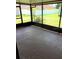 Enclosed patio with a view of the backyard and surrounding neighborhood at 610 Yak Ct, Kissimmee, FL 34759