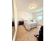 Comfortable bedroom featuring a queen bed, carpet, and a window at 6608 Harper Way, Harmony, FL 34773