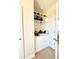 Walk-in closet with custom shelves and drawers for organized storage at 6608 Harper Way, Harmony, FL 34773