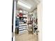 Walk-in closet featuring custom organization system at 6608 Harper Way, Harmony, FL 34773