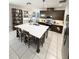 The spacious kitchen features an oversized island with seating, modern appliances, and ample cabinet space at 6608 Harper Way, Harmony, FL 34773