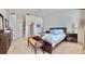 Spacious main bedroom featuring neutral carpet and natural light at 6608 Harper Way, Harmony, FL 34773
