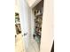 Walk-in pantry with shelves stocked with food and household supplies at 6608 Harper Way, Harmony, FL 34773
