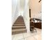 Carpeted staircase leading to the upper level of the home at 6608 Harper Way, Harmony, FL 34773