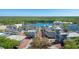 Stunning aerial shot showcasing a community near a lake with various buildings and ample parking at 675 Celebration Ave, Celebration, FL 34747
