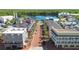 Aerial view featuring the main street lined with colorful buildings and palm trees at 675 Celebration Ave, Celebration, FL 34747