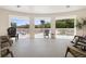 Open-air balcony with a view of the street, white railings, and comfortable seating at 675 Celebration Ave, Celebration, FL 34747