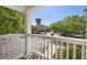 This scenic balcony overlooks a charming street with lush trees and buildings beyond at 675 Celebration Ave, Celebration, FL 34747