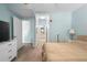 Comfortable bedroom with neutral tones, carpet, and an en-suite bathroom at 675 Celebration Ave, Celebration, FL 34747