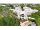 Attractive building exterior features manicured landscaping, decorative balconies and street parking at 675 Celebration Ave, Celebration, FL 34747