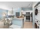 Open concept kitchen and living area with stainless steel appliances and dining table at 675 Celebration Ave, Celebration, FL 34747