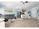 Inviting living space with a glass dining set, comfortable sofa, and modern stainless steel appliances at 675 Celebration Ave, Celebration, FL 34747