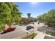 Scenic street view showcasing the clock tower, landscaped median, and surrounding businesses at 675 Celebration Ave, Celebration, FL 34747